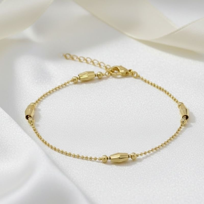PULSEIRA COM BOLINHAS BANHADA A OURO 18K