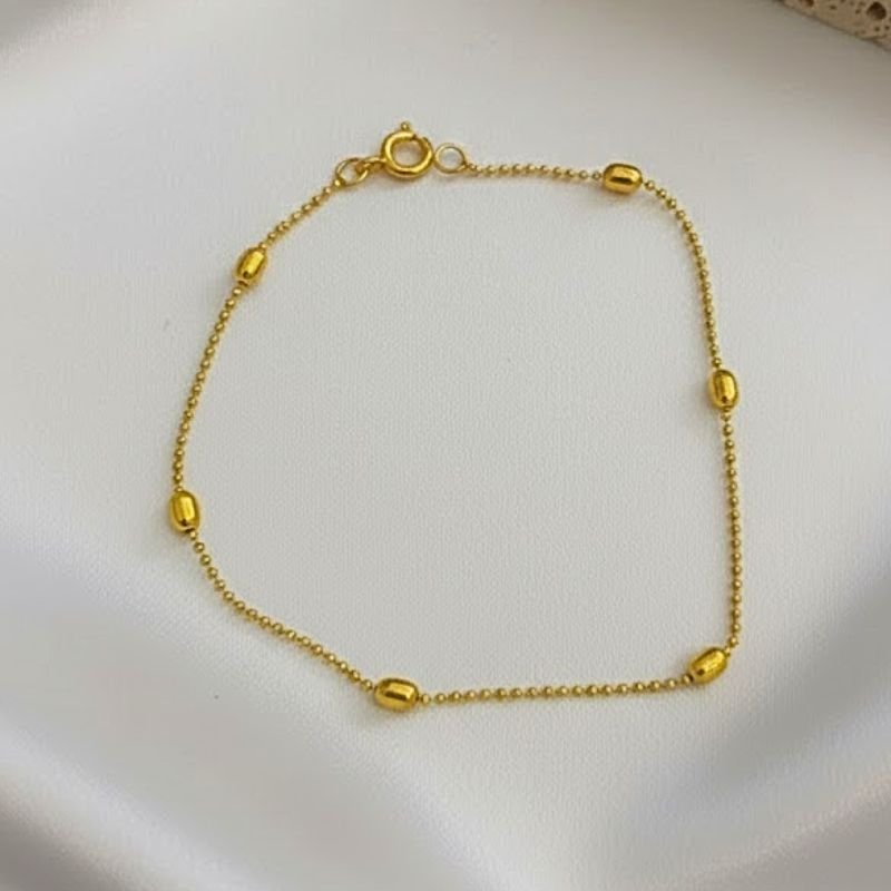 PULSEIRA DELICADA COM ESFERAS