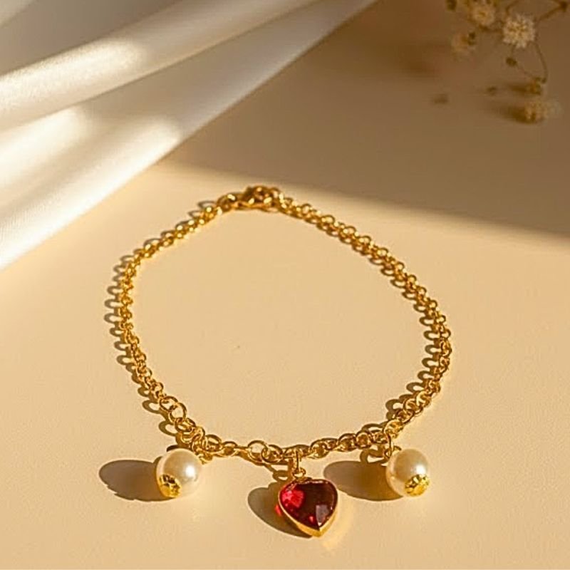 PULSEIRA PÉROLA E CORAÇÃO VERMELHO